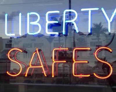 Liberty Safes neon sign in our window.
